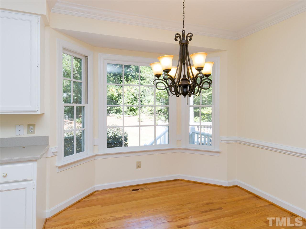 1312 Binley Place Raleigh, NC 27615 - Photo 6 of 22 a view of a room with a window and chandelier