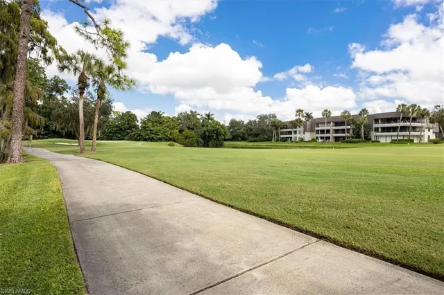 a view of a golf course with a lake