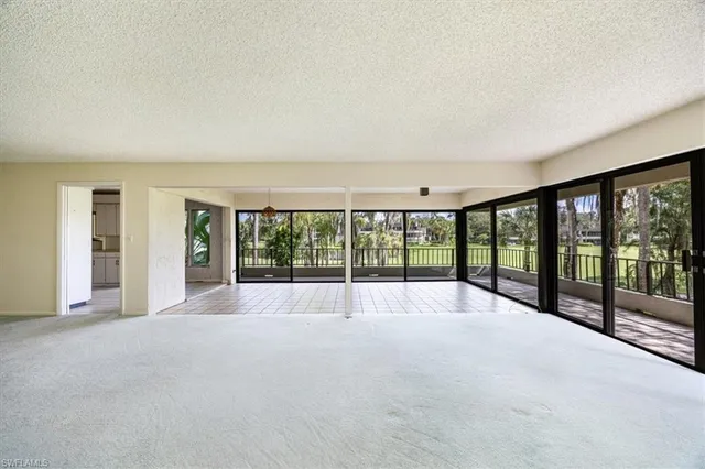 a view of an empty room with a large window