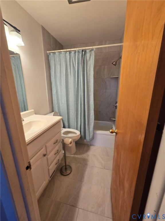 19247 Courthouse Road Yale, VA 23897 - Photo 5 of 14 a bathroom with a sink a toilet and shower curtain