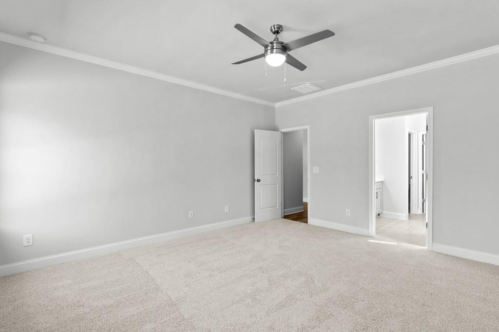 154 Greenview Court Homer, GA 30547 - Photo 27 of 44 an empty room with a ceiling fan and a window