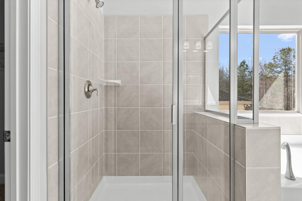 154 Greenview Court Homer, GA 30547 - Photo 30 of 44 a bathroom with a glass shower door