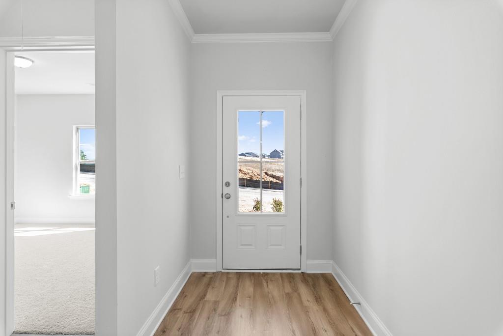 154 Greenview Court Homer, GA 30547 - Photo 4 of 44 a view of a hallway with wooden floor and a bathroom