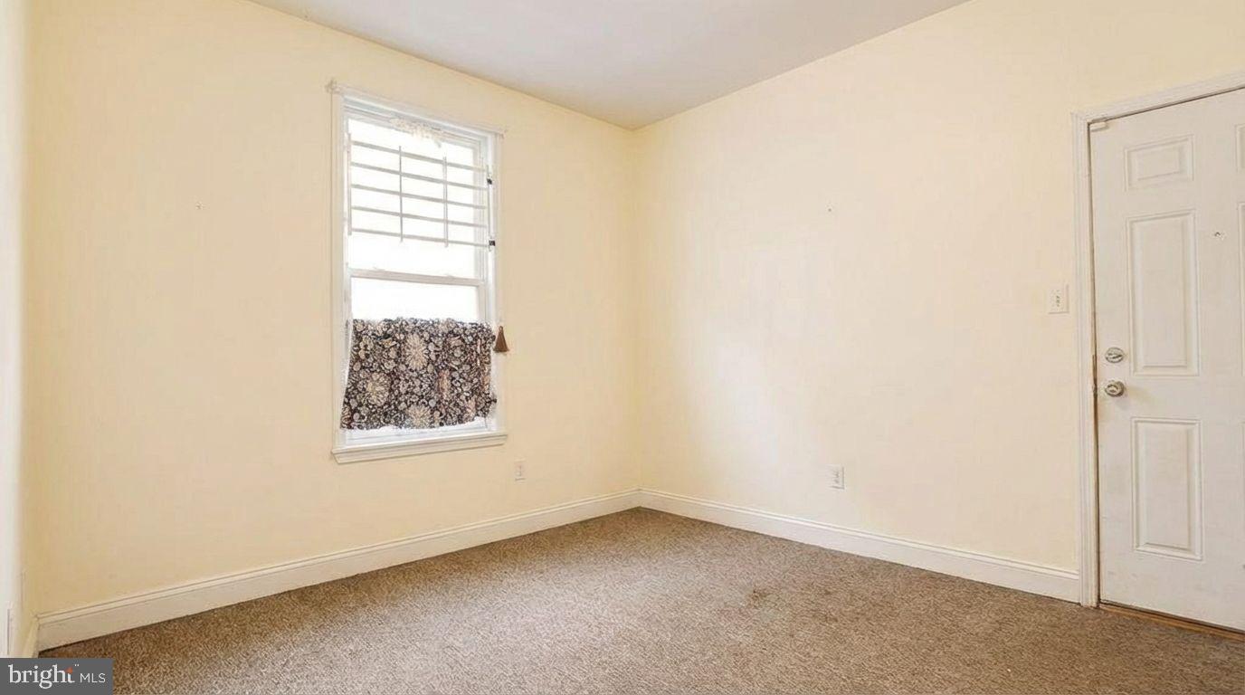 1920 North 18th Street, Unit 1 Philadelphia, PA 19121 - Photo 7 of 12 an empty room with windows