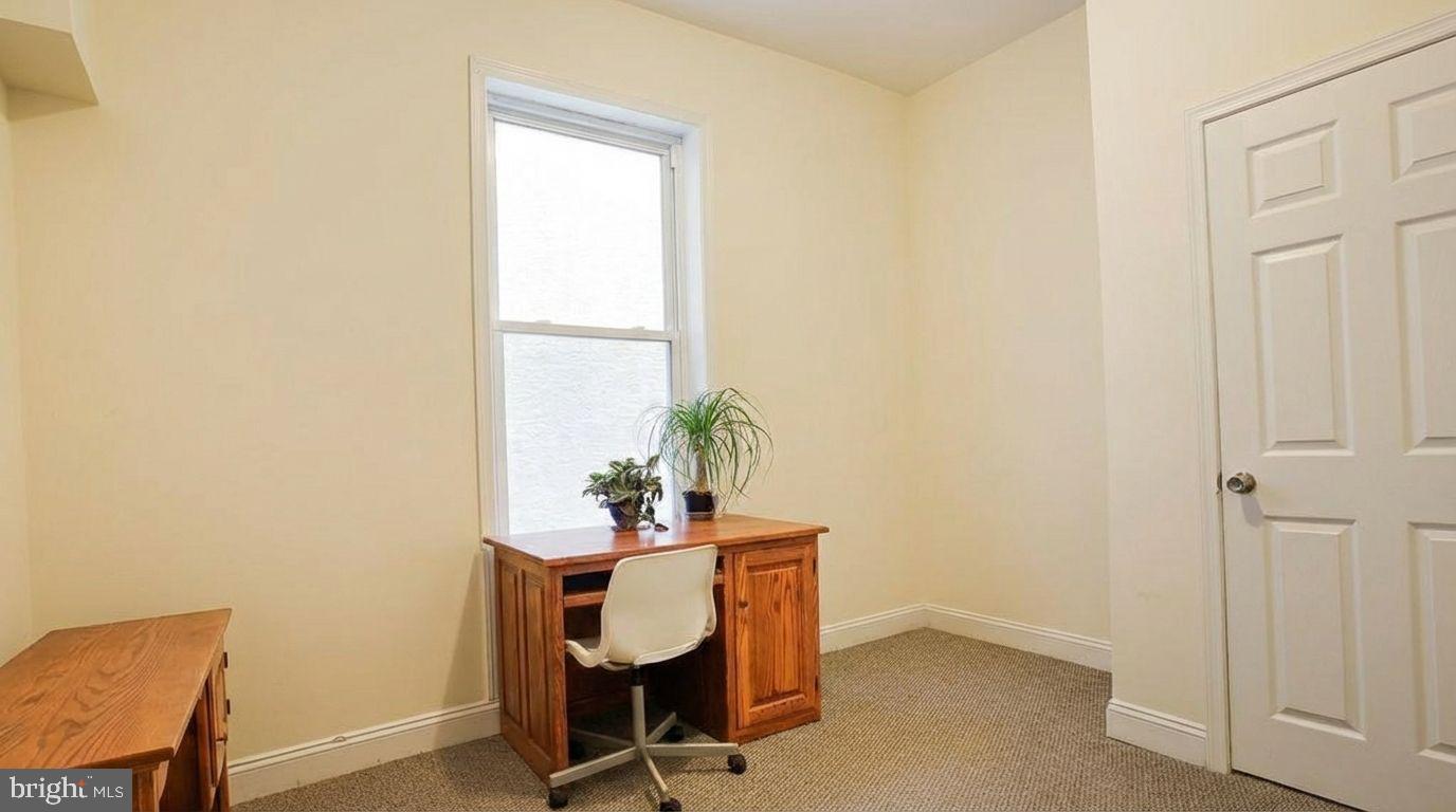 1920 North 18th Street, Unit 1 Philadelphia, PA 19121 - Photo 10 of 12 a dining room with furniture and wooden floor