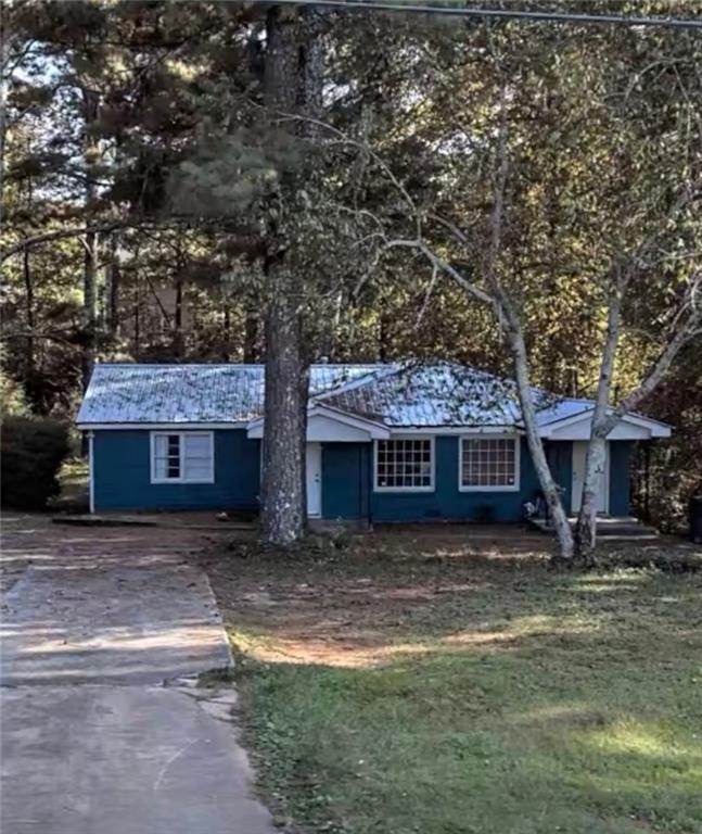 528 Springlake Road Lawrenceville, GA 30045 - Photo 1 of 1 a front view of a house with garden