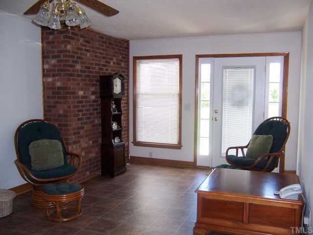 2431 Flat River Church Road Roxboro, NC 27574 - Photo 4 of 12 a living room with furniture and wooden floor