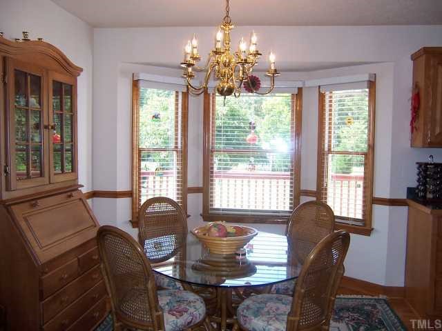 2431 Flat River Church Road Roxboro, NC 27574 - Photo 7 of 12 a dining room with furniture and window