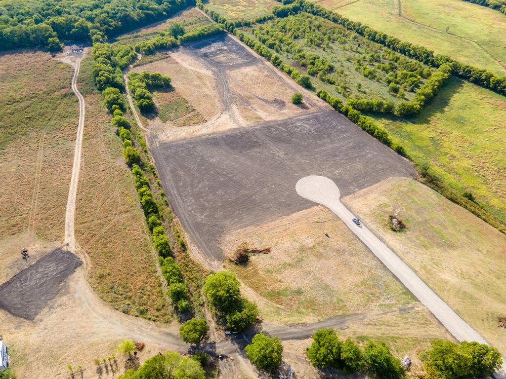 Lot 3 Lookout Circle Forney, TX 75126 - Photo 5 of 9 a view of a swimming pool with a yard
