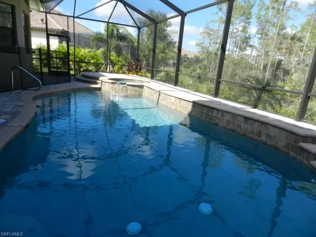 a view of swimming pool with patio