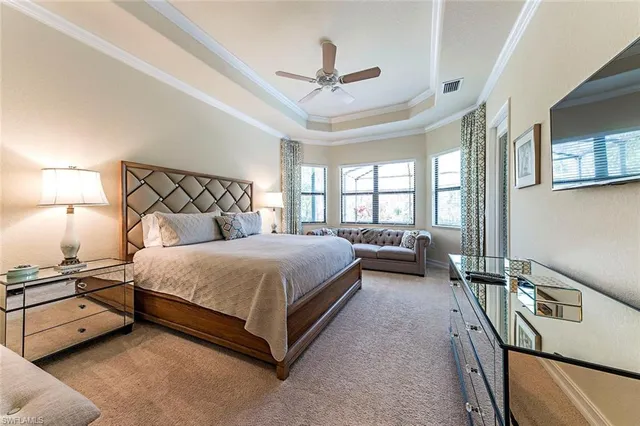 a bedroom with a bed and a night stand