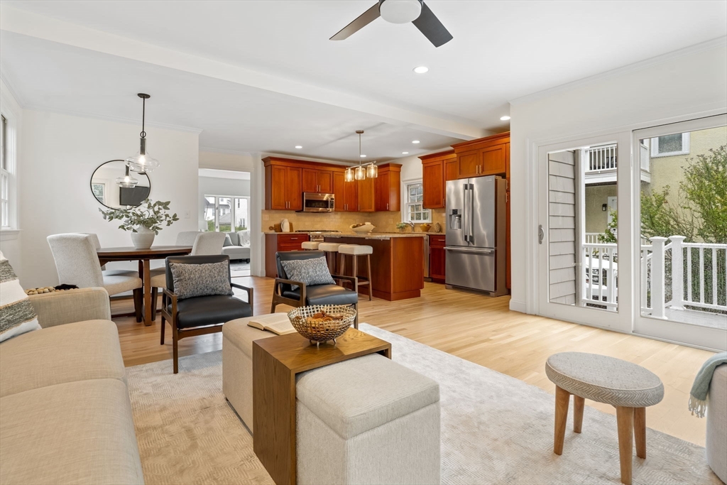 108 Warren Street Arlington, MA 02474 - Photo 16 of 42 a living room with stainless steel appliances kitchen island granite countertop furniture and a kitchen view
