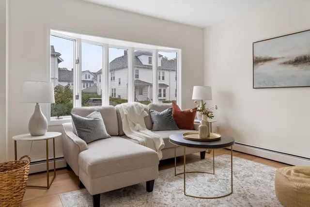 a living room with furniture and a large window