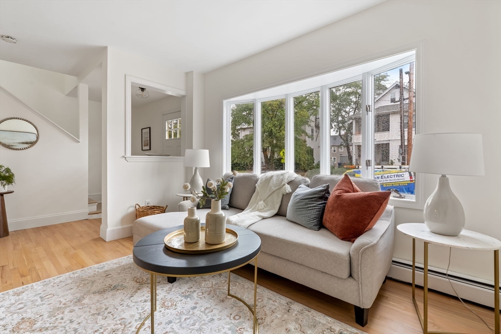 108 Warren Street Arlington, MA 02474 - Photo 20 of 42 a living room with furniture and a large window