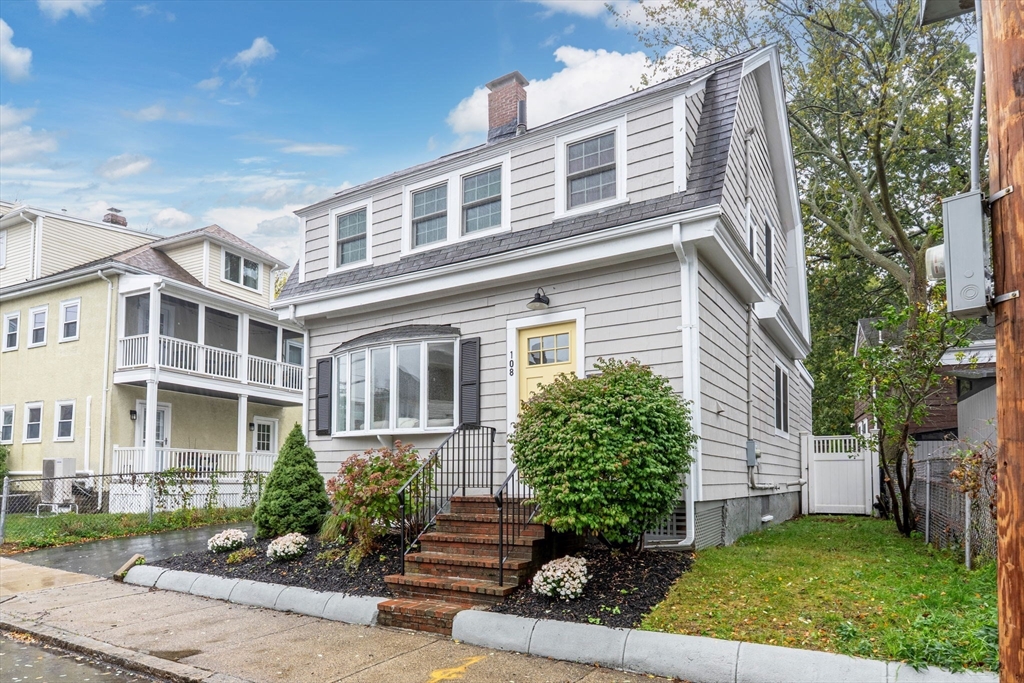 108 Warren Street Arlington, MA 02474 - Photo 2 of 42 front view of a house with a yard