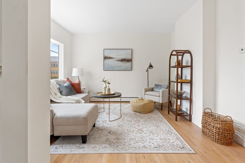 108 Warren Street Arlington, MA 02474 - Photo 22 of 42 a living room with furniture and wooden floor