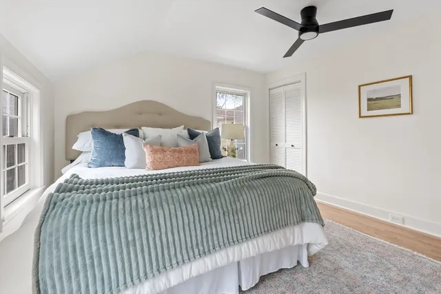 a bedroom with a bed and window
