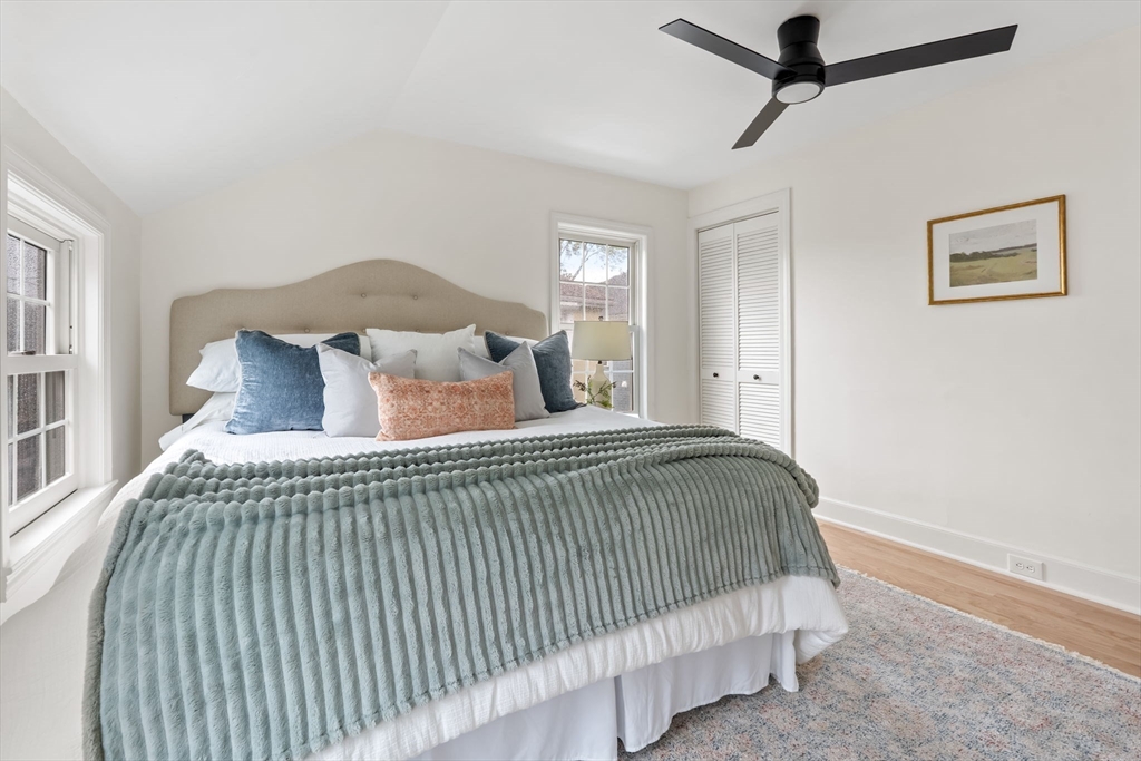 108 Warren Street Arlington, MA 02474 - Photo 25 of 42 a bedroom with a bed and window