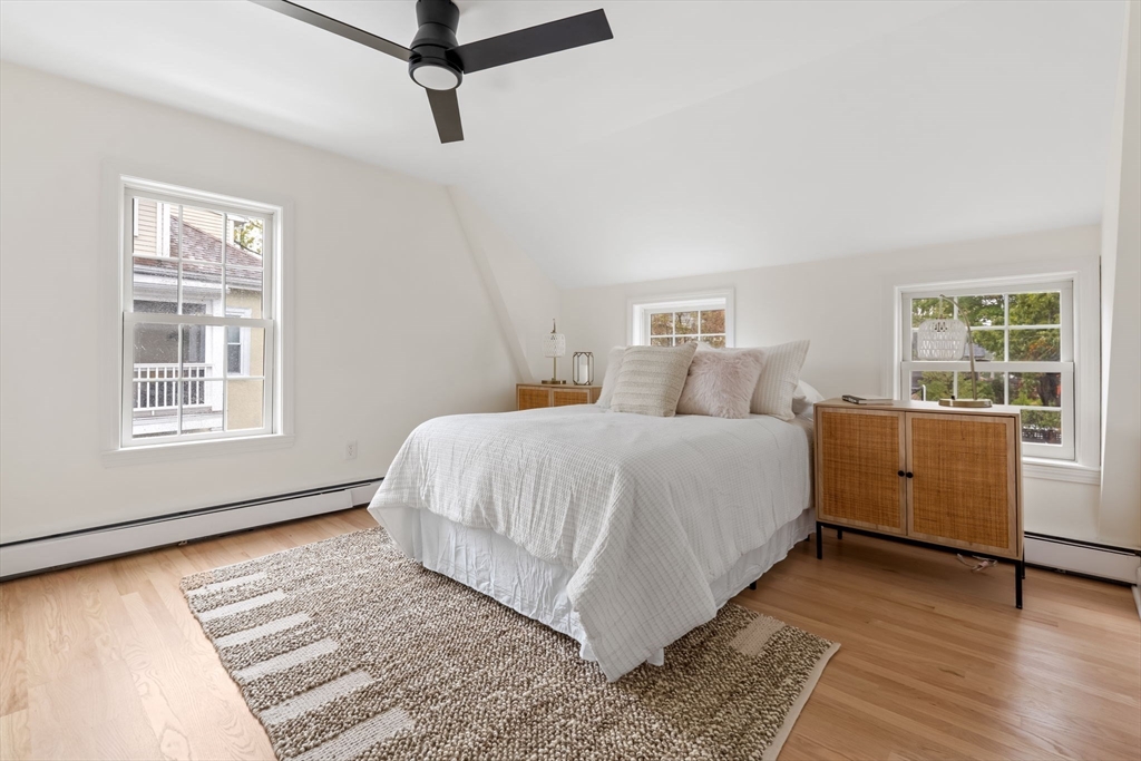 108 Warren Street Arlington, MA 02474 - Photo 27 of 42 a bedroom with a bed and a window