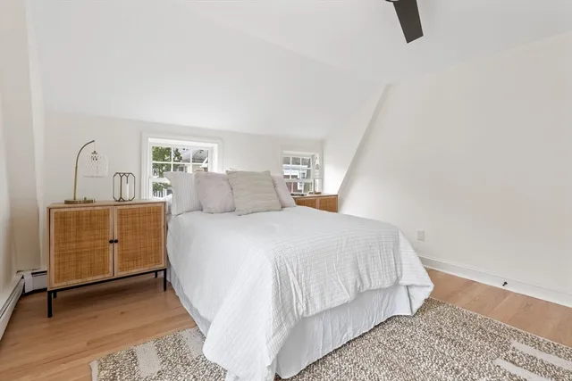 a bedroom with a bed and dresser