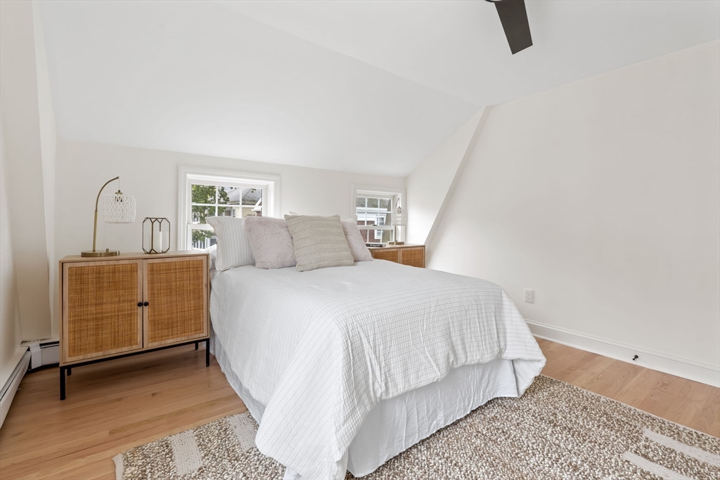 108 Warren Street Arlington, MA 02474 - Photo 28 of 42 a bedroom with a bed and dresser