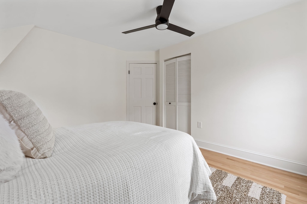 108 Warren Street Arlington, MA 02474 - Photo 29 of 42 a bedroom with a bed and a window