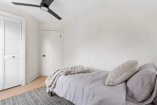 a bedroom with a bed and a couch