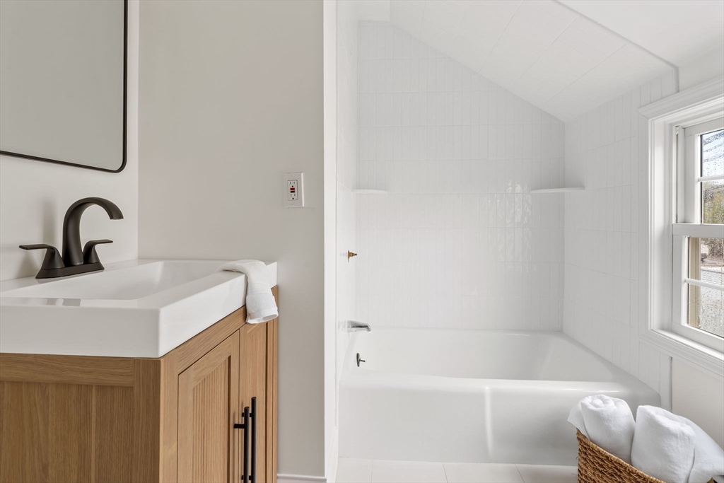 108 Warren Street Arlington, MA 02474 - Photo 33 of 42 a bathroom with a sink and a bathtub
