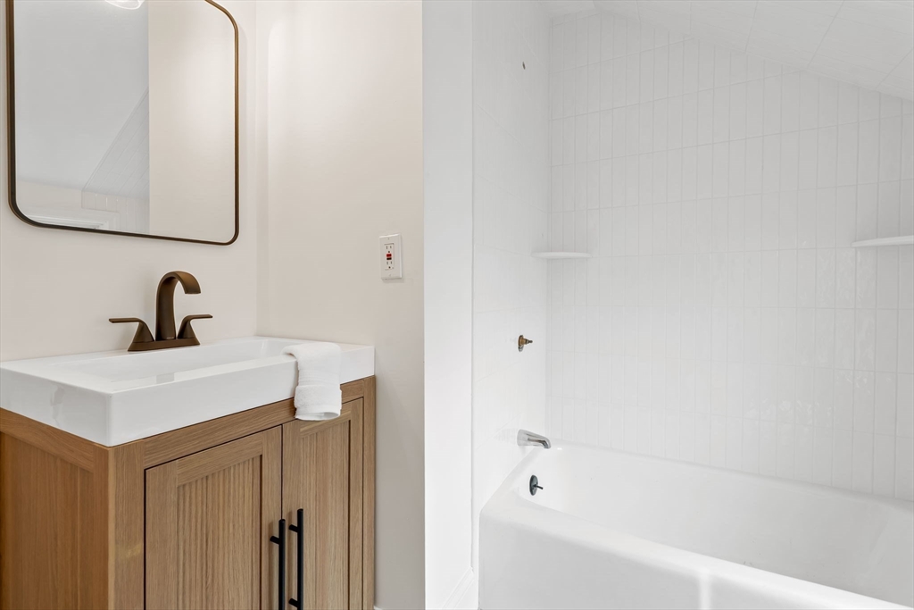 108 Warren Street Arlington, MA 02474 - Photo 34 of 42 a bathroom with a sink and a mirror