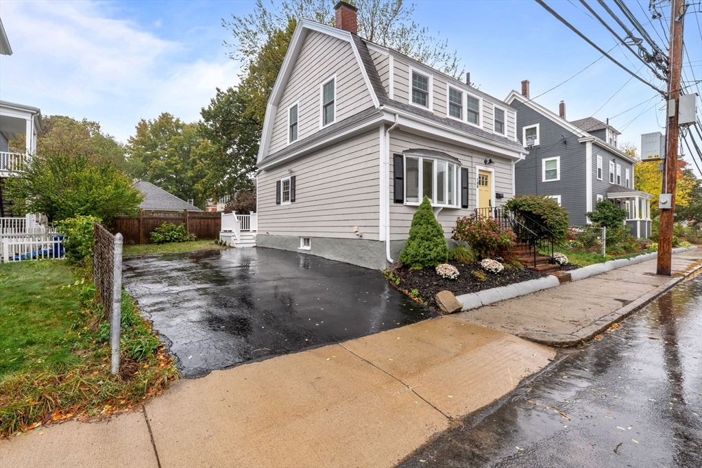 108 Warren Street Arlington, MA 02474 - Photo 39 of 42 a view of a house with backyard and sitting area