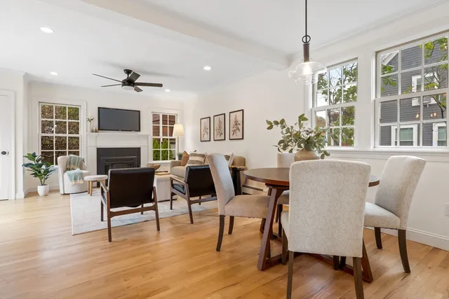 a view of a livingroom with furniture window and wooden floor