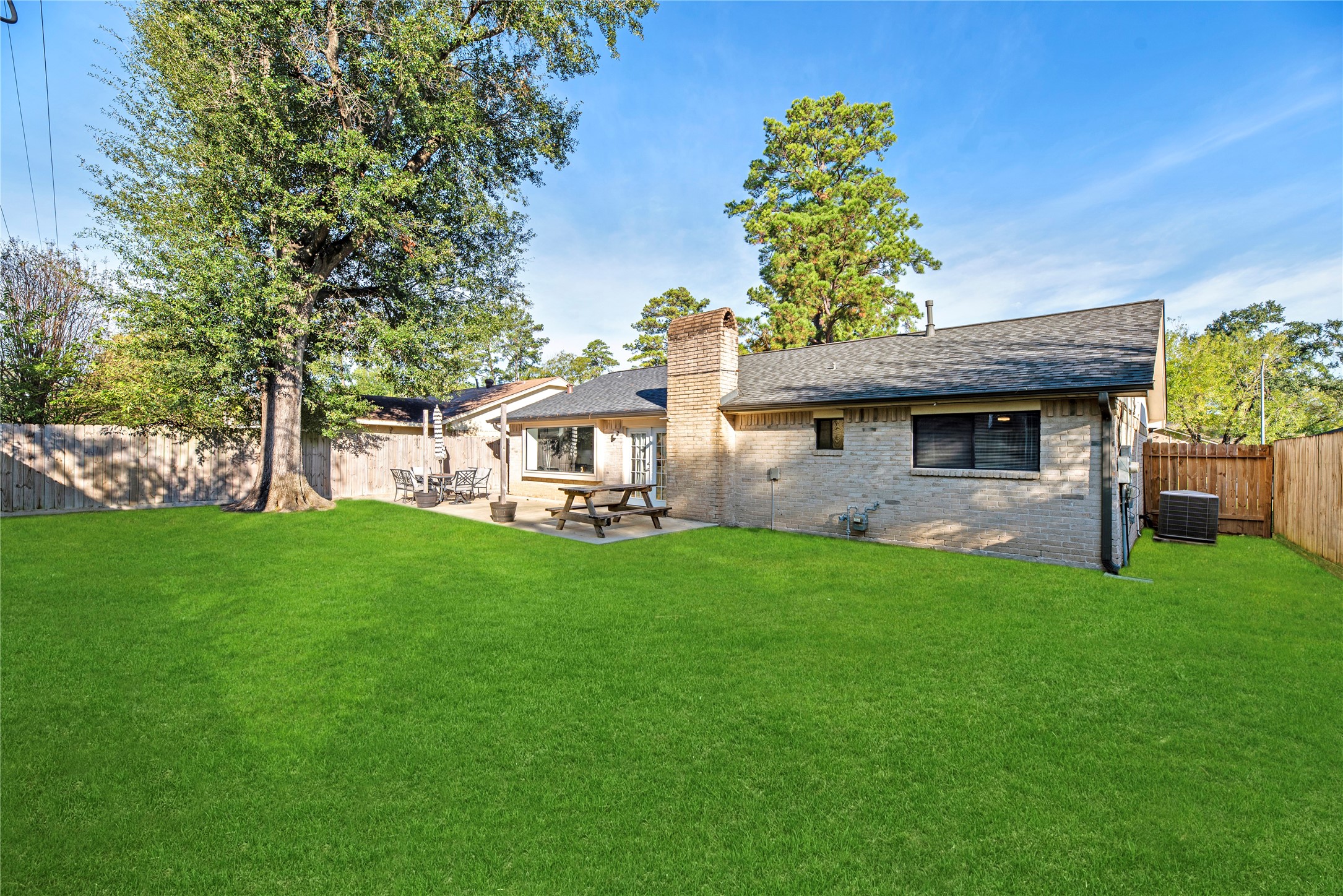 3519 Acorn Way Lane Spring, TX 77389 - Photo 15 of 15 a view of a house with backyard and a tree