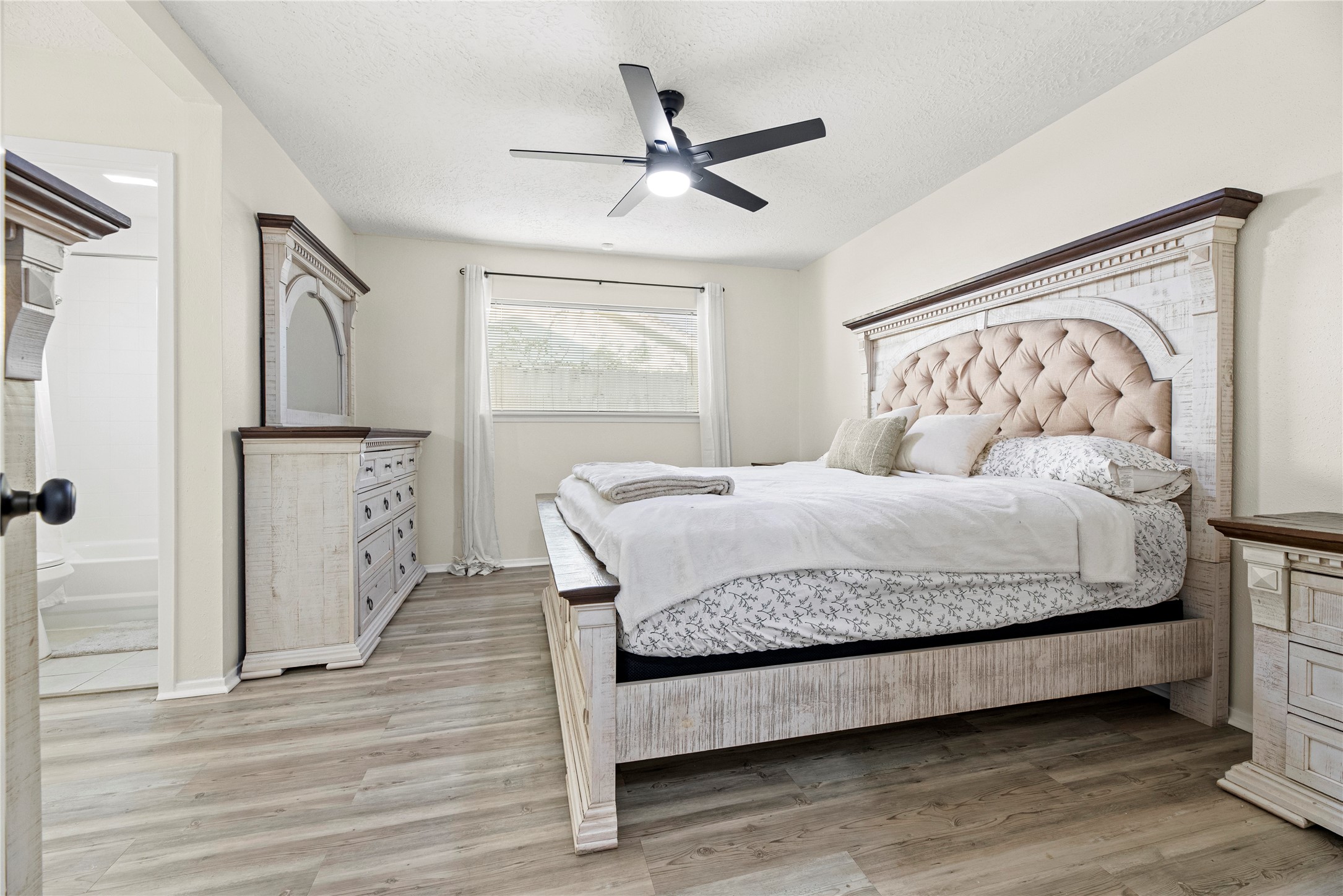 3519 Acorn Way Lane Spring, TX 77389 - Photo 6 of 15 a bedroom with a bed and wooden floor