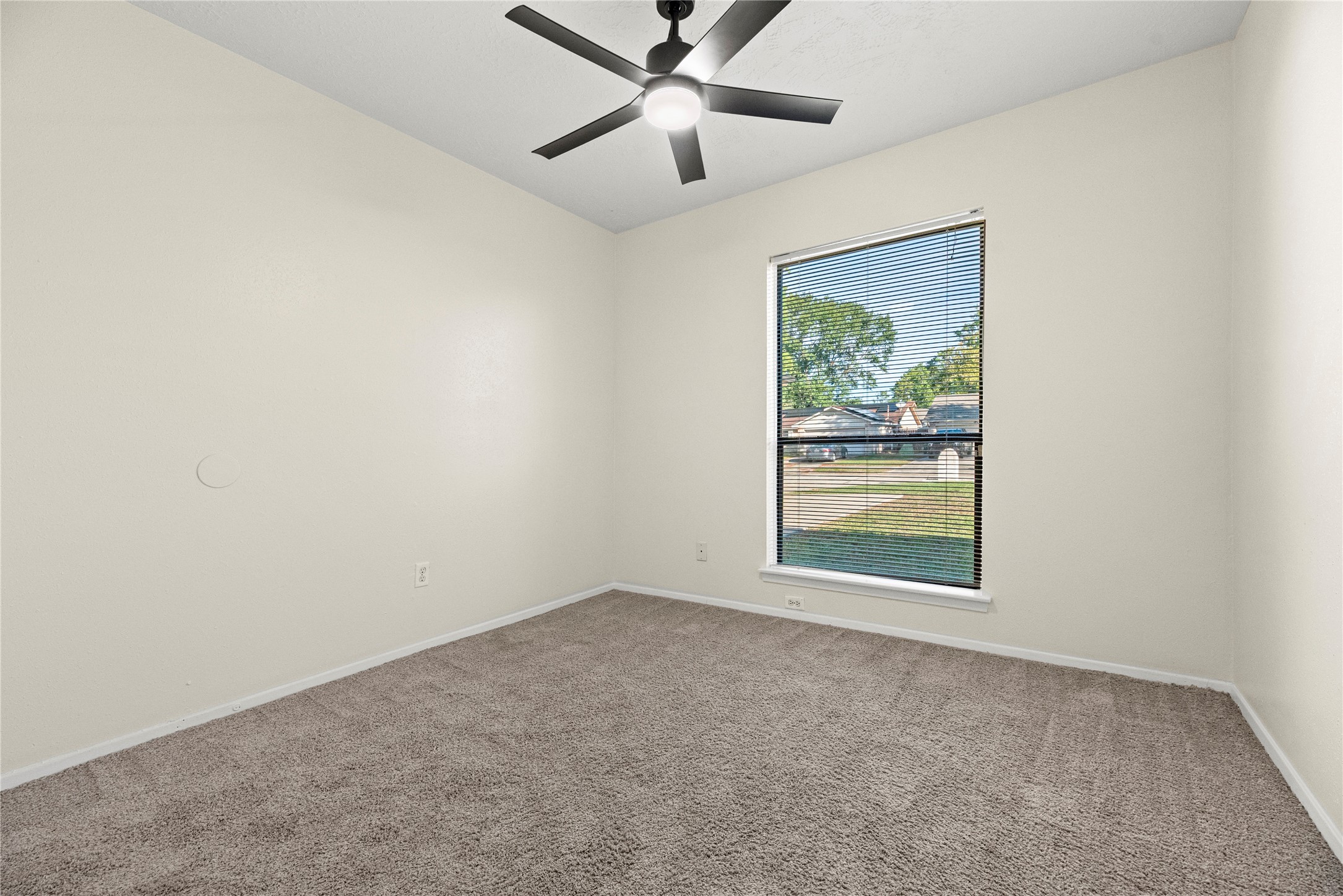 3519 Acorn Way Lane Spring, TX 77389 - Photo 9 of 15 an empty room with a window and a ceiling fan