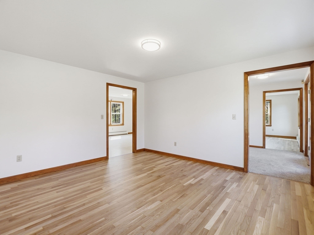 26 Nevada Road Tyngsborough, MA 01879 - Photo 24 of 42 a view of an empty room and wooden floor