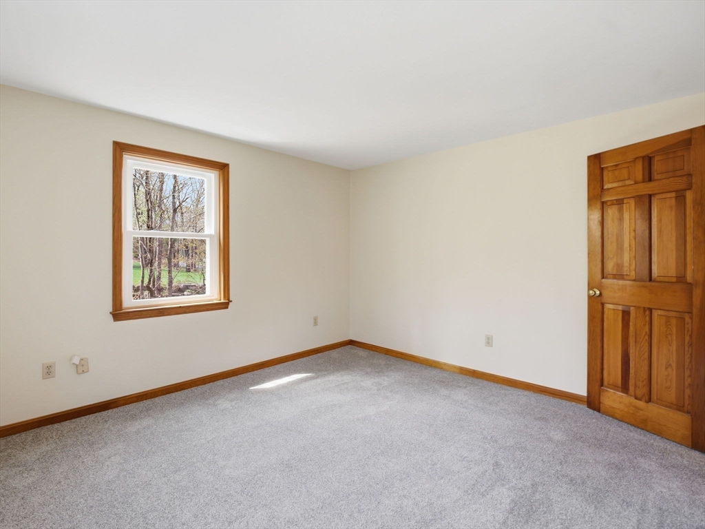 26 Nevada Road Tyngsborough, MA 01879 - Photo 32 of 42 an empty room with windows