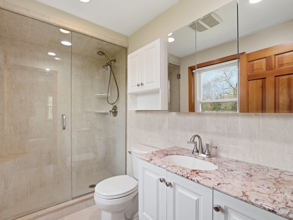 26 Nevada Road Tyngsborough, MA 01879 - Photo 34 of 42 a bathroom with a granite countertop sink toilet and shower