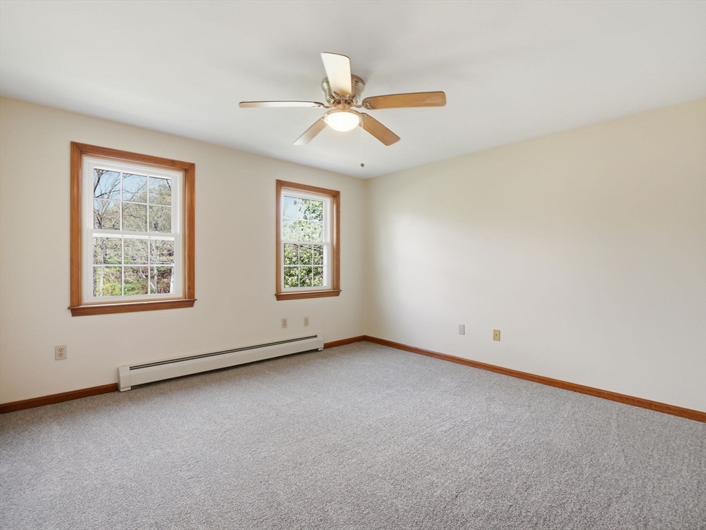 26 Nevada Road Tyngsborough, MA 01879 - Photo 35 of 42 an empty room with windows and fan