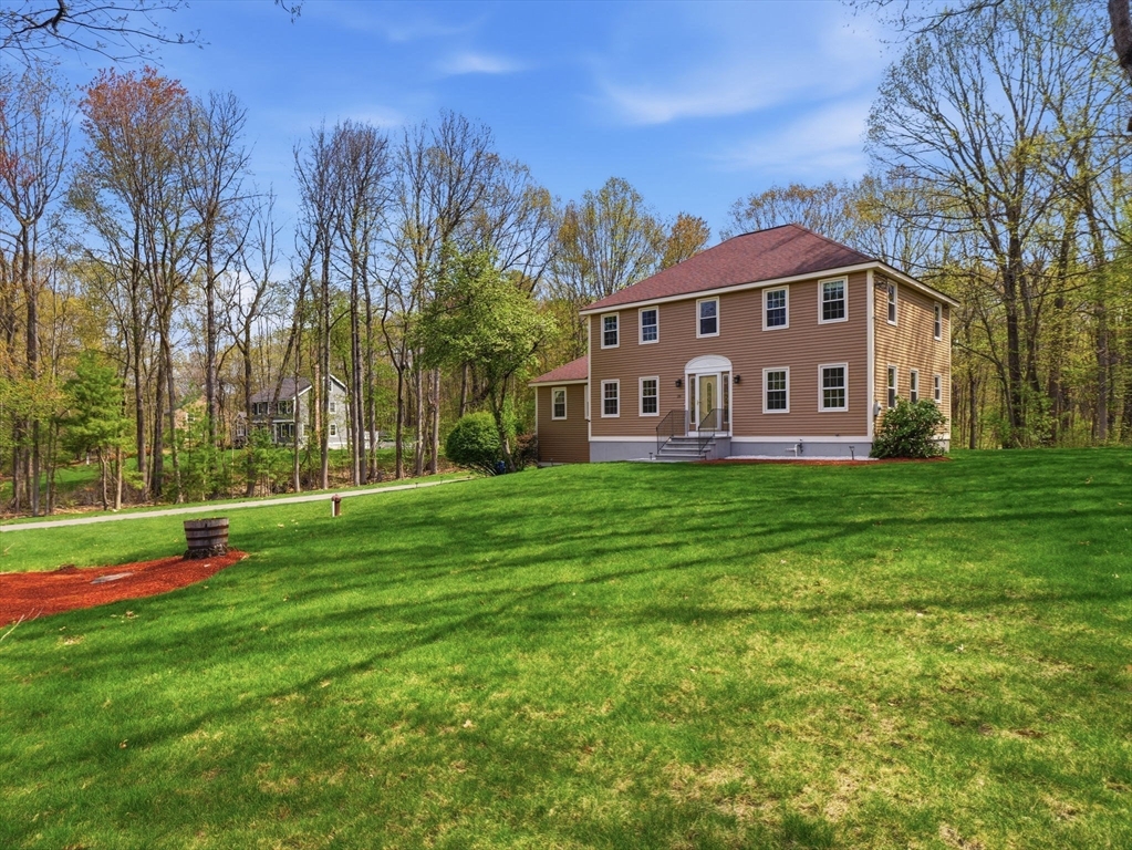 26 Nevada Road Tyngsborough, MA 01879 - Photo 42 of 42 a view of a house with a yard and sitting area