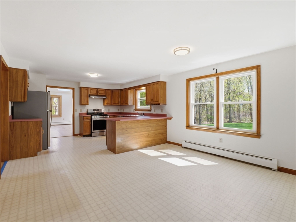 26 Nevada Road Tyngsborough, MA 01879 - Photo 6 of 42 a view of kitchen with furniture and refrigerator