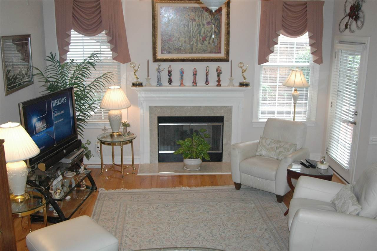 7316 Fontana Ridge Lane Raleigh, NC 27613 - Photo 12 of 20 Family room has 10' ceilings, hardwoods, access to the deck/screen porch area Den/Family/Great Room