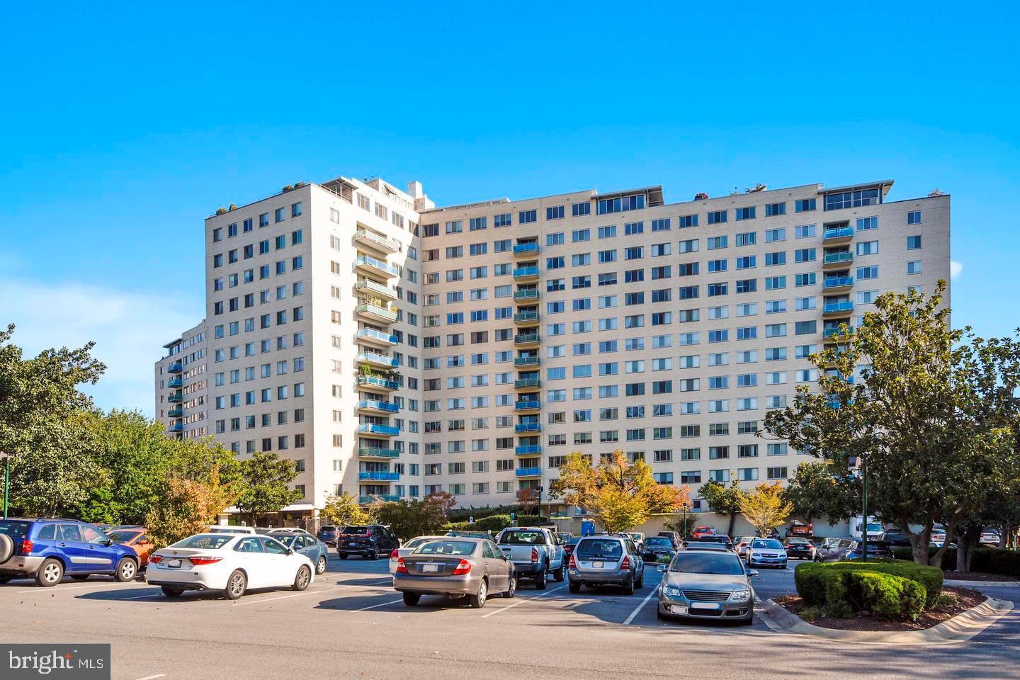 10201 Grosvenor Place, Unit 1006 Rockville, MD 20852 - Photo 1 of 9 a car parked in front of a building