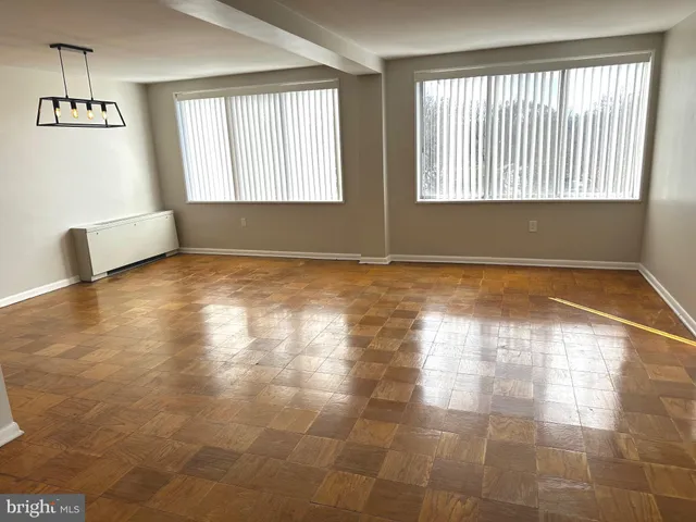 a view of an empty room with a window