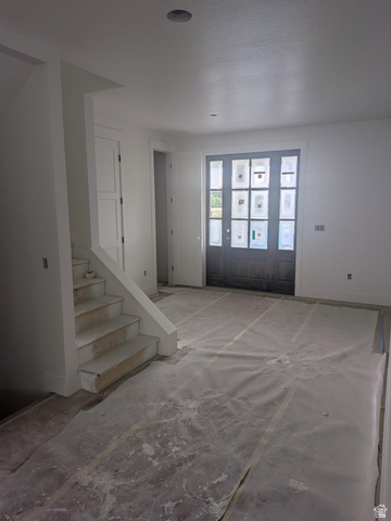 2771 West Aurora Avenue Mapleton, UT 84664 - Photo 14 of 39 Entryway featuring a multi-paneled front door, recessed lighting, and a prominent staircase