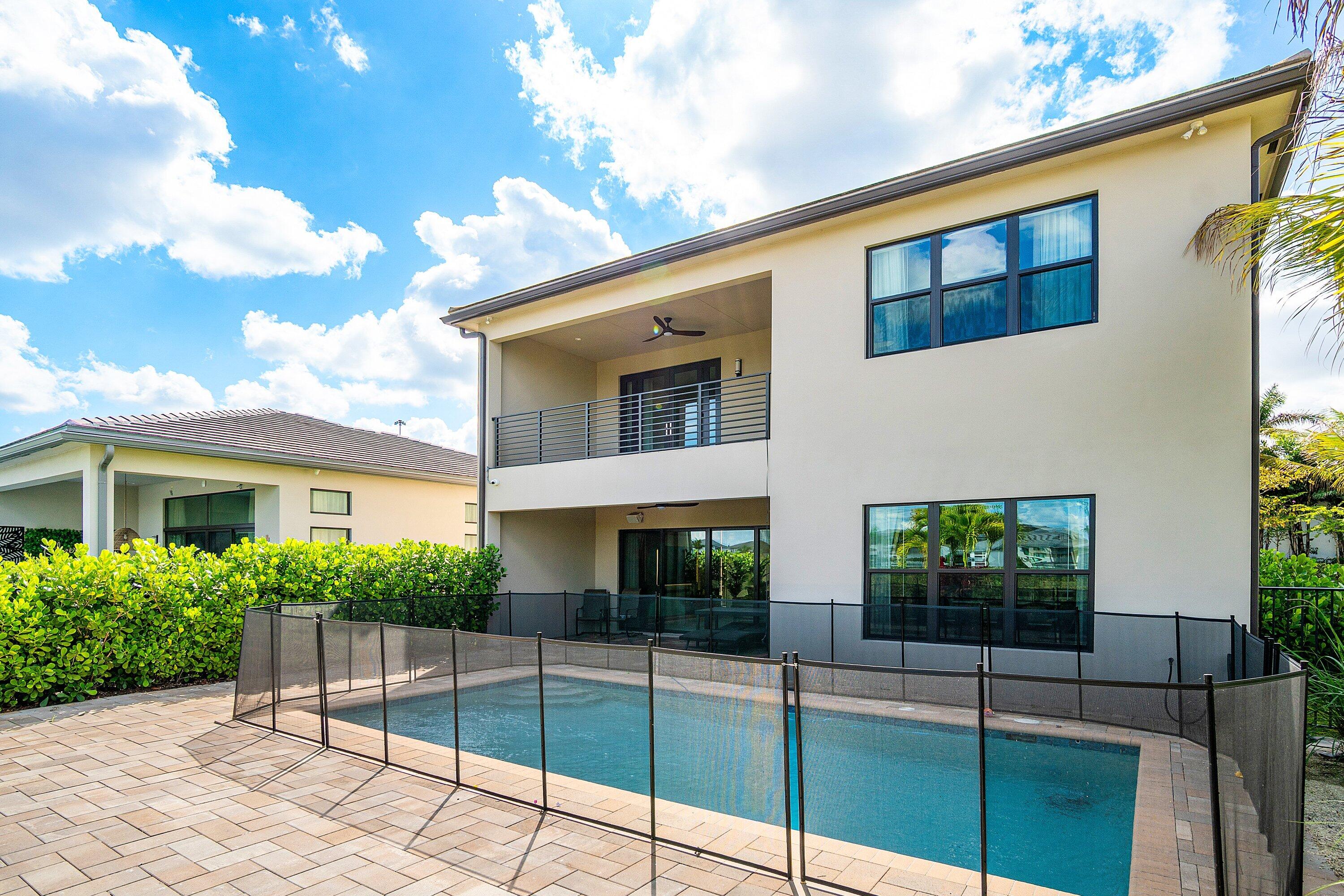 8233 Crystal Downs Avenue Boca Raton, FL 33434 - Photo 53 of 58 a view of a house with a backyard