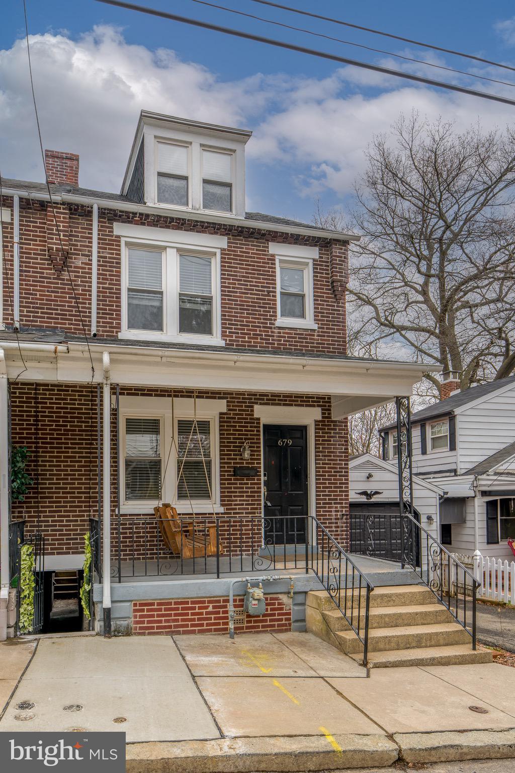 679 Poplar Street Lancaster, PA 17603 - Photo 1 of 32 a front view of a building with a garden
