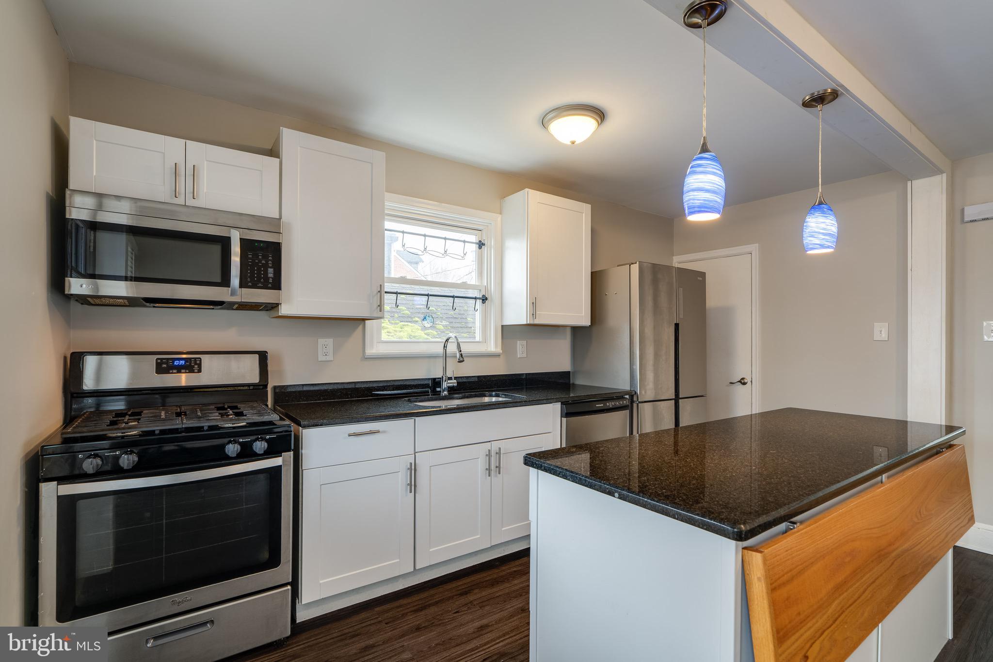 679 Poplar Street Lancaster, PA 17603 - Photo 11 of 32 a kitchen with granite countertop a sink and steel appliances