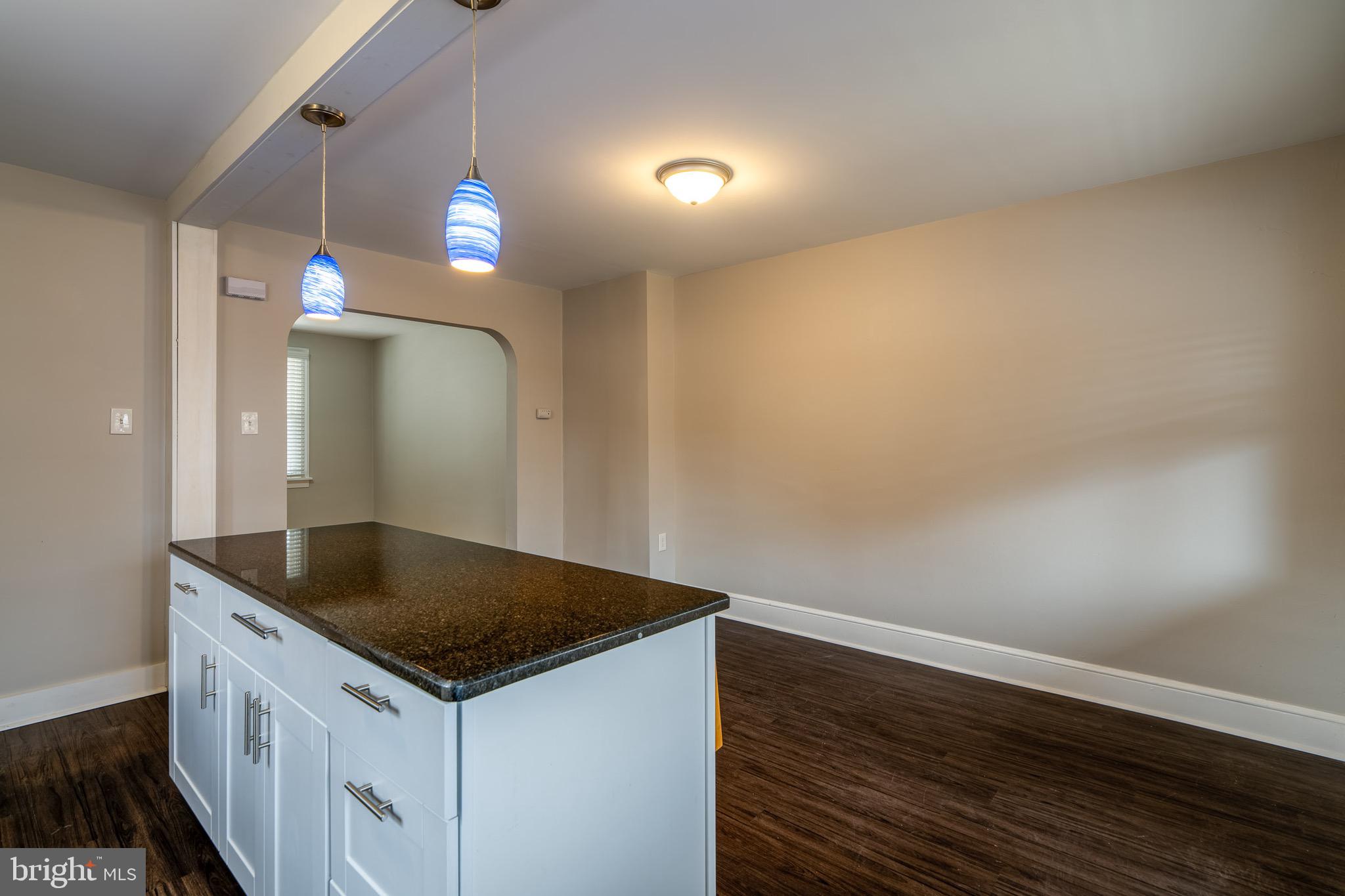 679 Poplar Street Lancaster, PA 17603 - Photo 12 of 32 a kitchen that has a sink cabinets and wooden floor