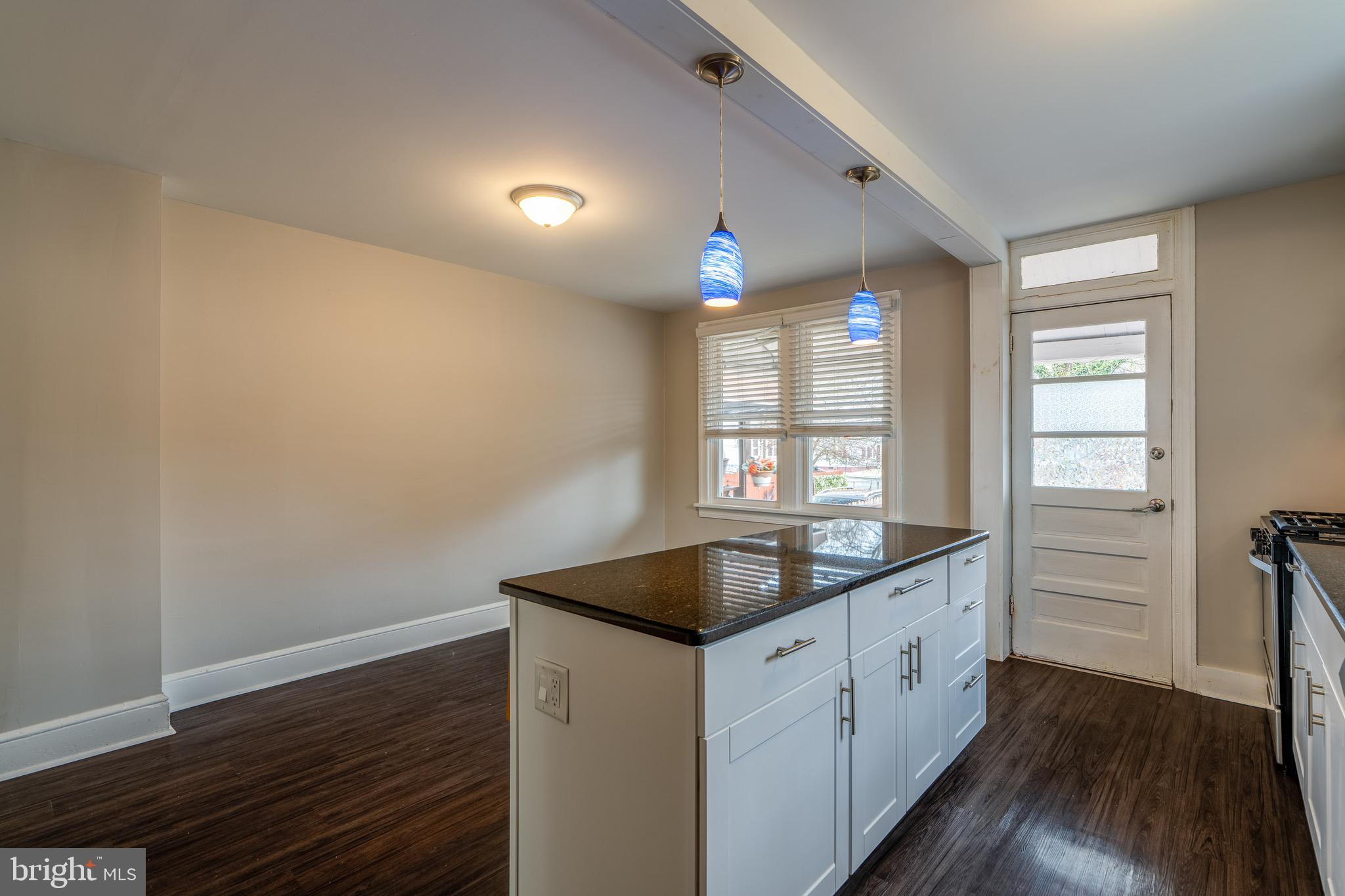 679 Poplar Street Lancaster, PA 17603 - Photo 14 of 32 a kitchen with sink cabinets and wooden floor