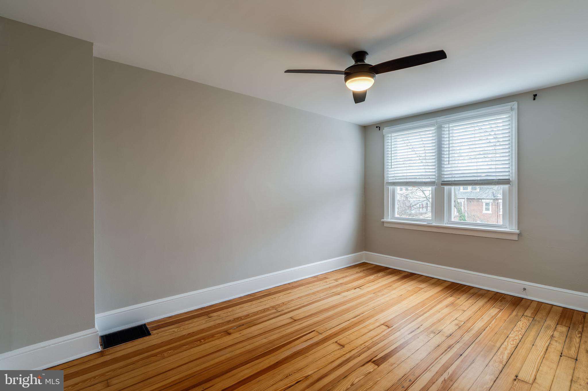 679 Poplar Street Lancaster, PA 17603 - Photo 16 of 32 a view of empty room with wooden floor and fan